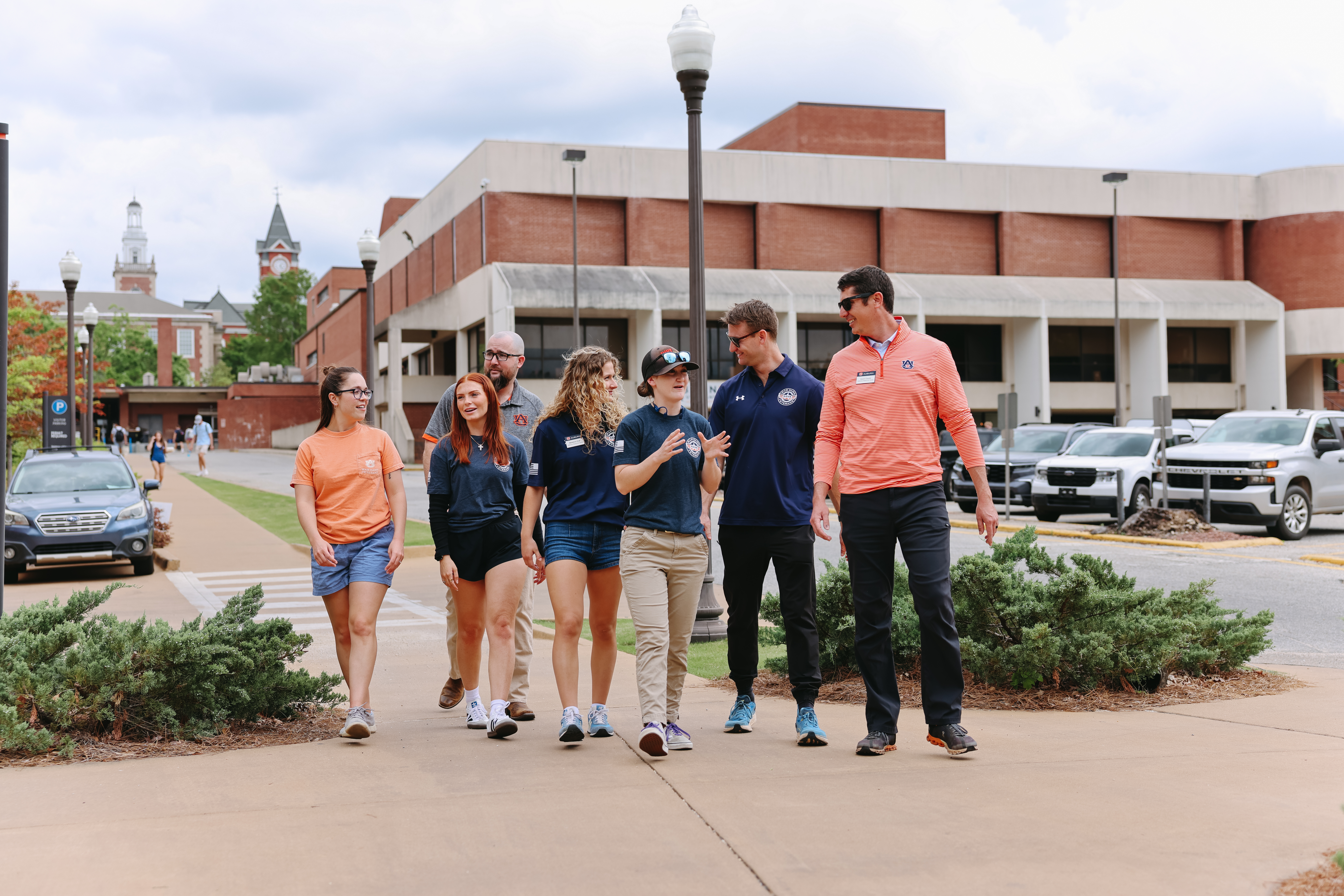 The ASVA team walking through campus chatting with each other.